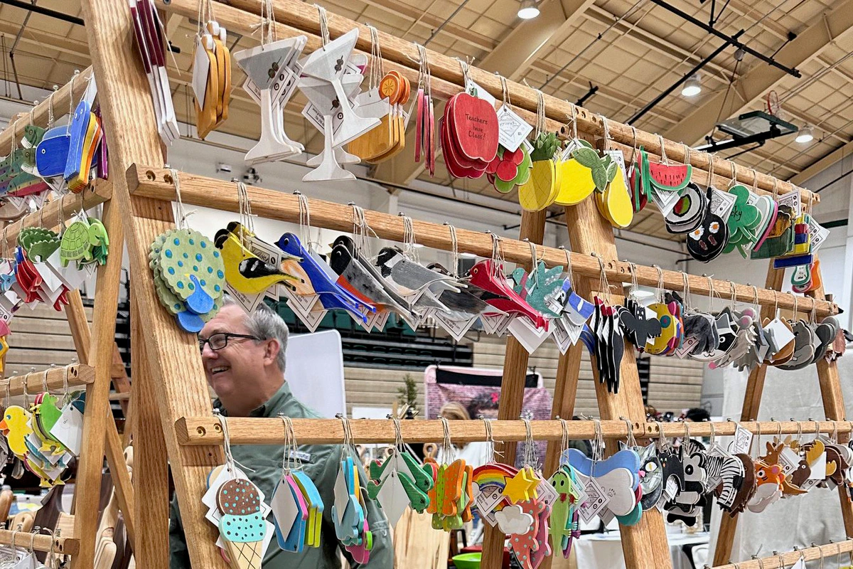 Handmade wooden ornaments displayed at the Athens Academy Holiday Market