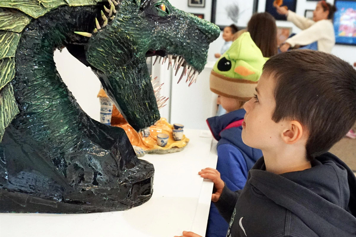 Athens Academy students explore artwork in a campus gallery